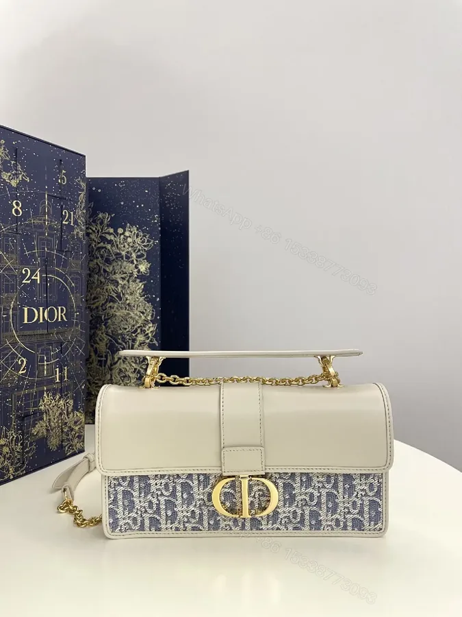View 1 of Textured Jacquard Evening Bag with Gold Hardware - Structured Chic