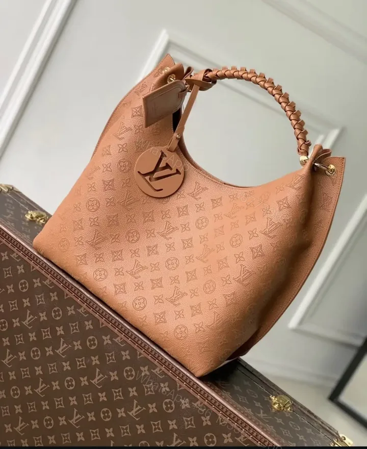 View 1 of Louis Vuitton Carmel Mahina Leather Hobo Bag in Cognac