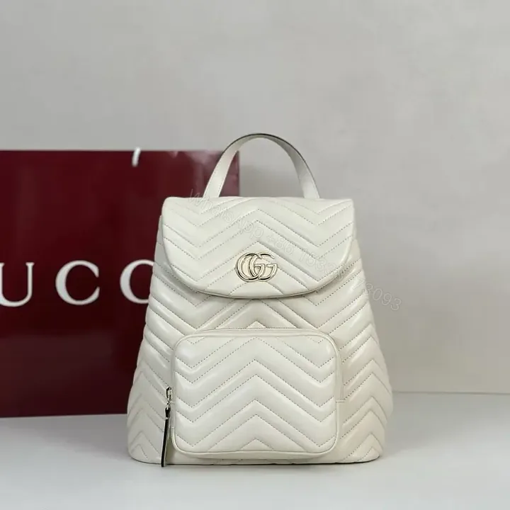 View 1 of Off-White Cream Quilted Chevron Backback with Gold Logo Flap