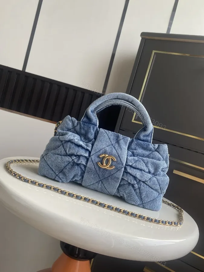 View 1 of Denim Quilted Mini Bag with Gold Hardware - Structured Chic