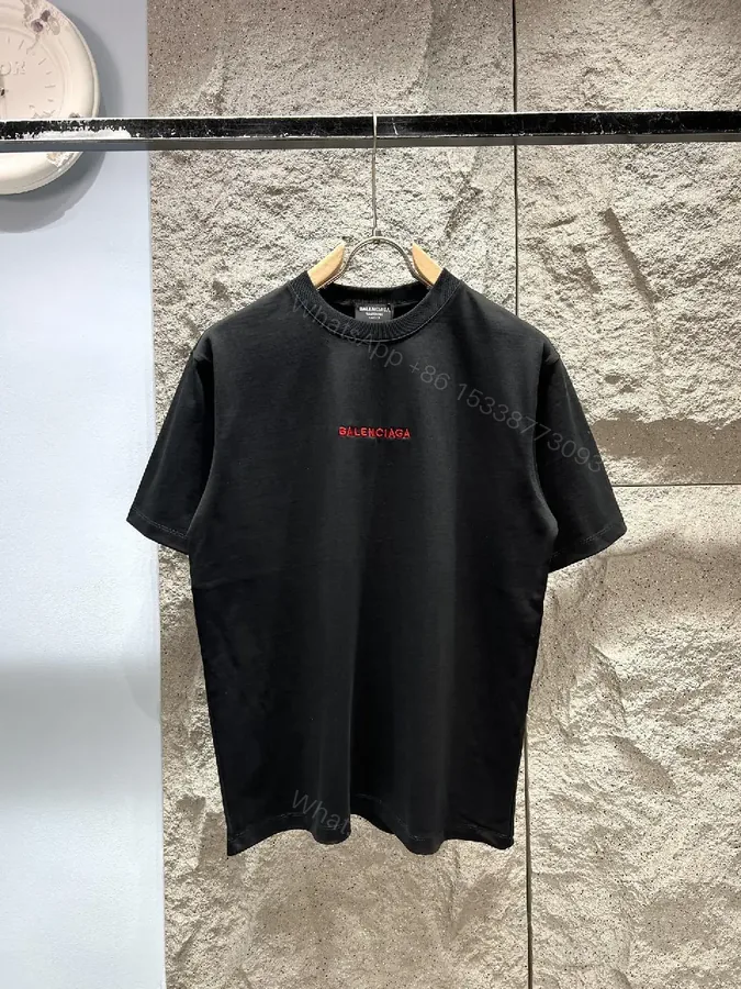 View 1 of Black Cotton Crewneck Tee with Subtle Red Logo Embroidery
