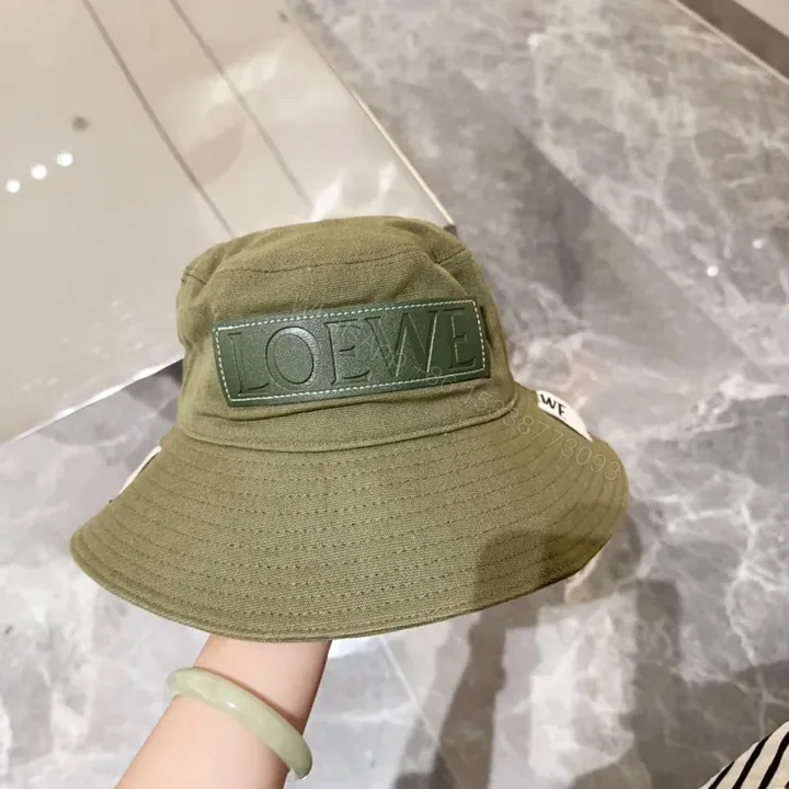 View 1 of Olive Canvas Bucket Hat: Subtle Luxury, LOEWE Patch