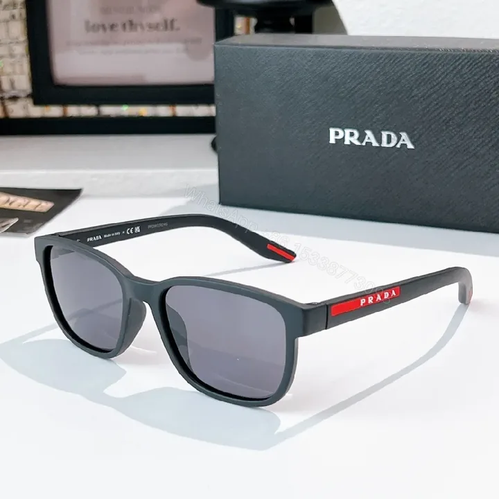 View 1 of Matte Black Prada Sunglasses – Subtle Metal Accents, Polarized UV