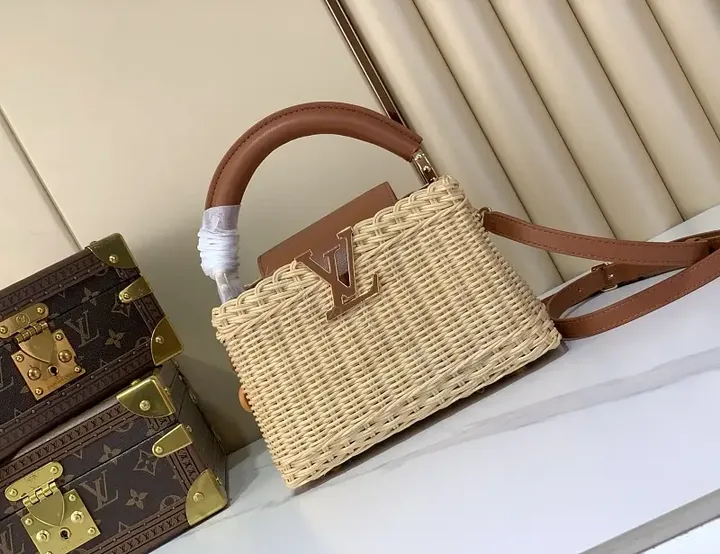 View 1 of Light Beige Straw Tote Bag with Leather Handles & Gold LV Charm