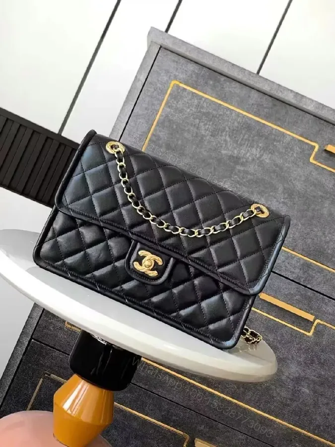 View 1 of Quilted Leather Flap Bag with Gold Chain, Compact Luxury