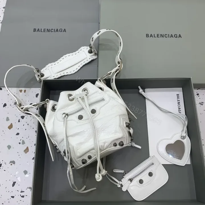 View 1 of White Textured Bucket Bag: Calfskin, Balenciaga-Inspired Luxury Bag