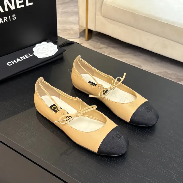 View 1 of Tan Leather Ballet Flats – Black-Tipped, Bow Accent, Cushioned Comfort