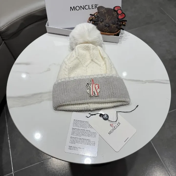 View 1 of Chic Winter Knit Beanie with Plush Pom and Moncler Accent