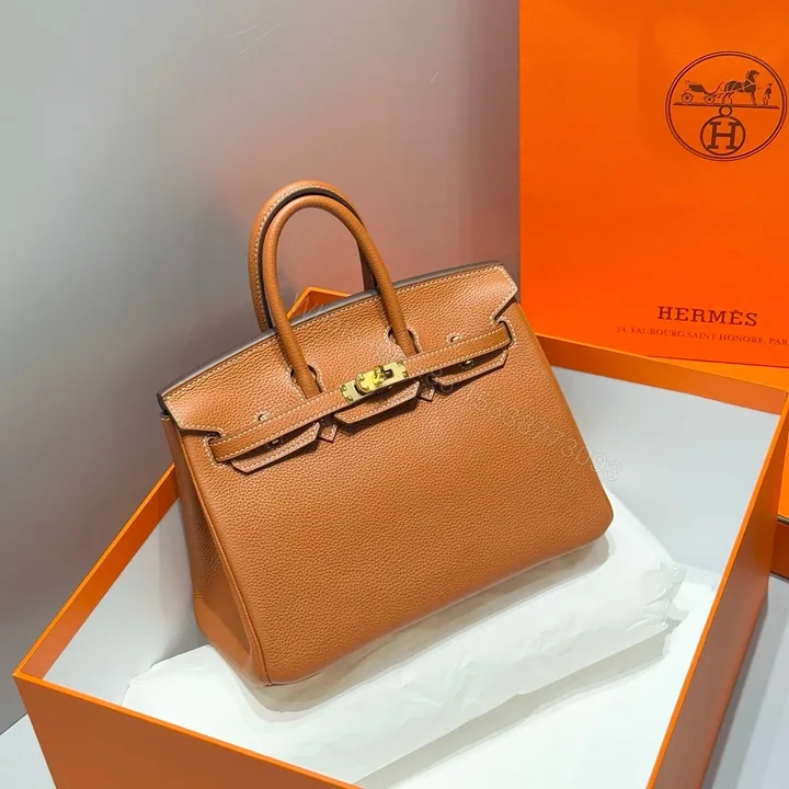 View 1 of HERMES 25S MEDIUM BIRKIN 25 IN BURNT ORANGE CALFSKIN GOLD HARDWARE