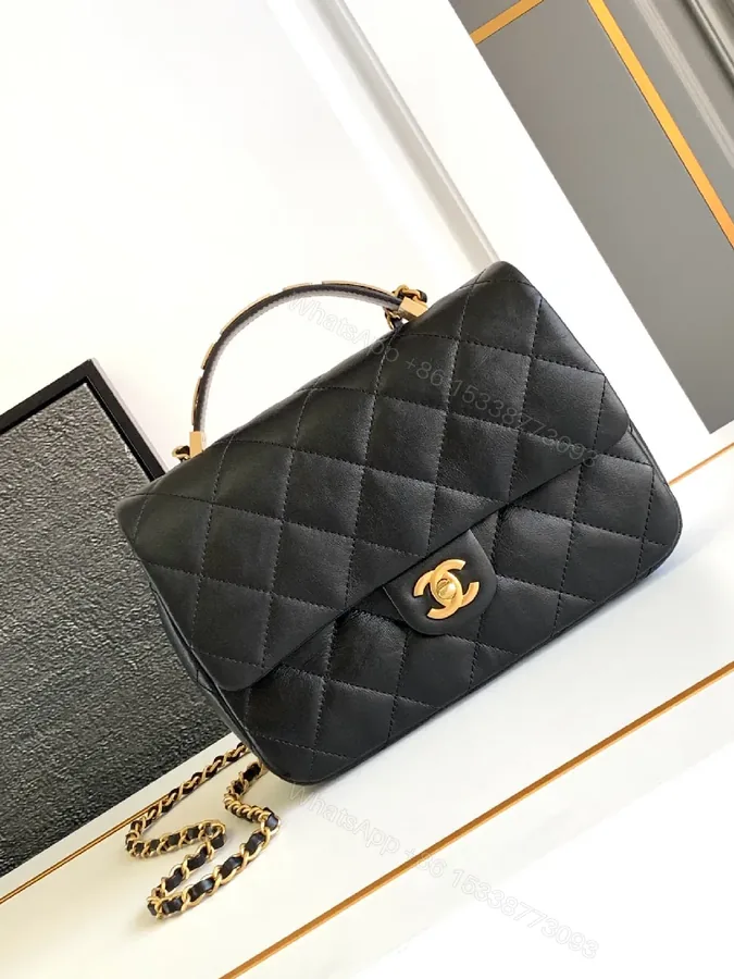 View 1 of Compact Dark Leather Quilted Flap Bag with Gold Hardware
