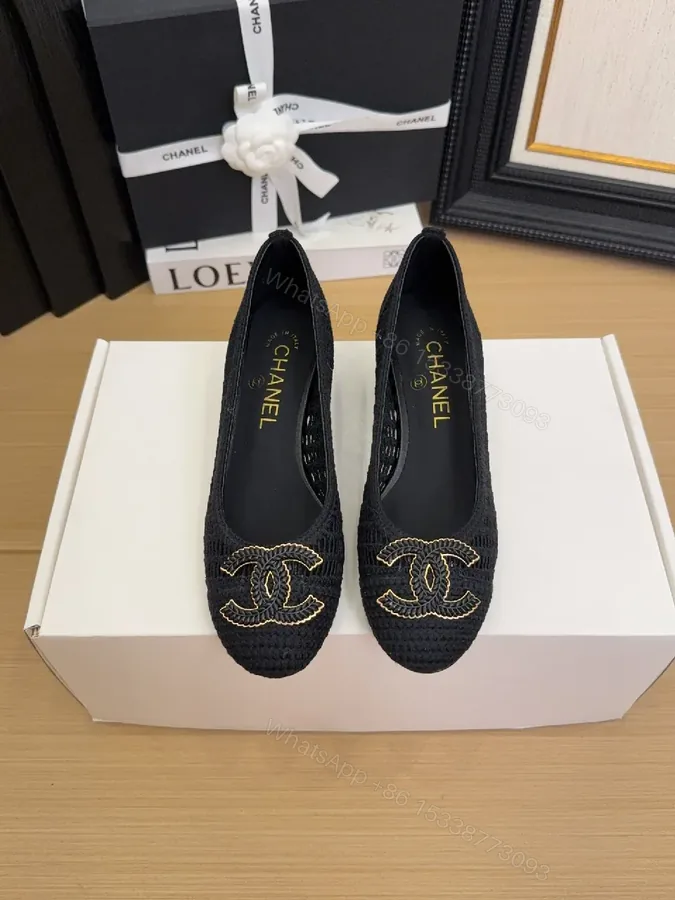 View 1 of Elegant Quilted Black Loafers with Gold Emblem: Everyday Luxury