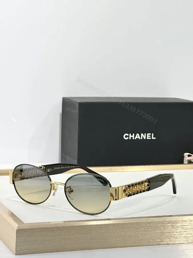 View 1 of Gold-Accented Round Sunglasses: Minimal Luxury Shield