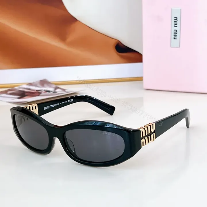 View 1 of Chic Black Miu Miu Sunglasses with Gold Accent - All-Day Shield