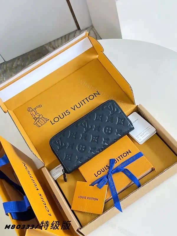 View 1 of Navy Leather Zip Continental Wallet with LV Embossed Monogram
