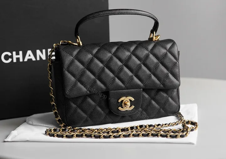 View 1 of Black Quilted Calfskin Mini Flap Bag with Gold Chain Accent (Chanel-Inspired)