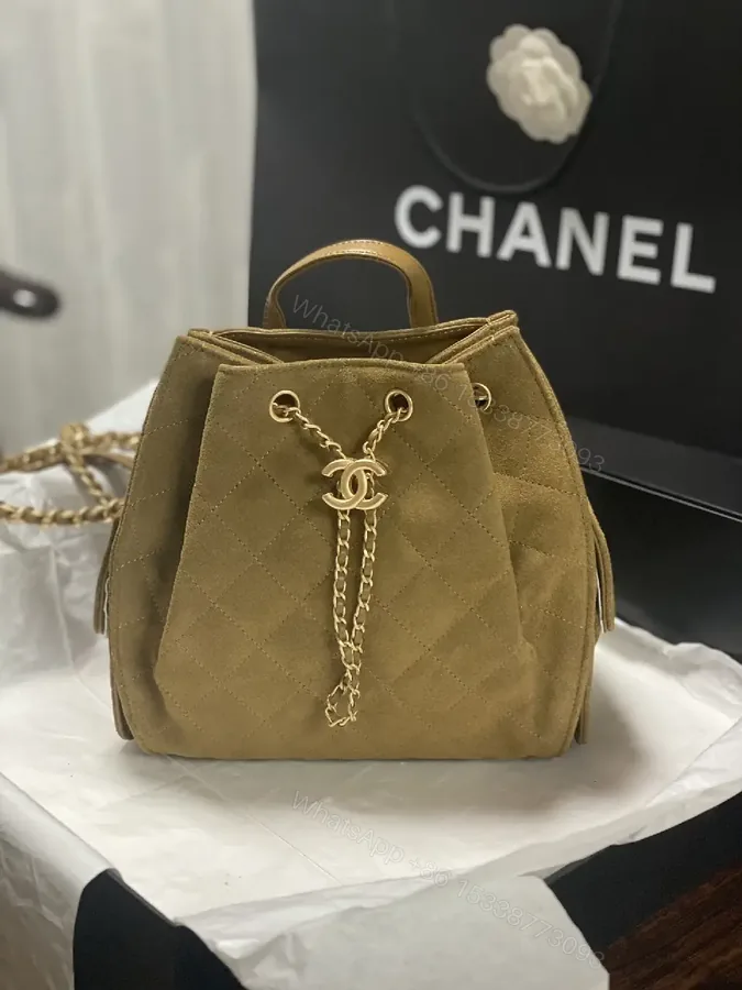View 1 of Quilted Suede Bucket Bag with Gold Crest Detail