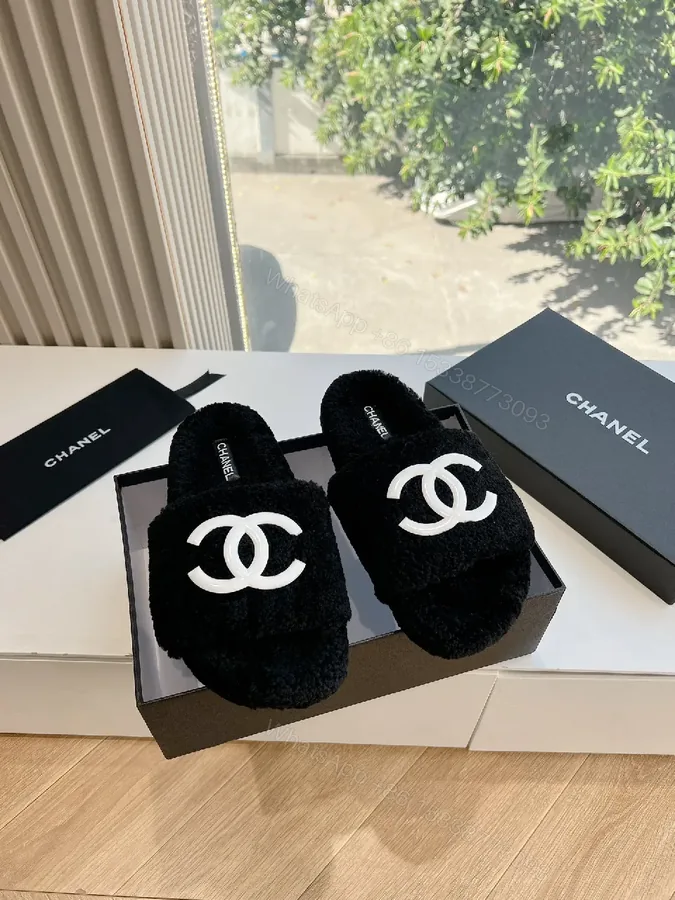 View 1 of Cozy Black Plush Slippers with Logo Detail