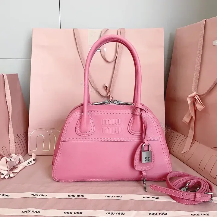 View 1 of Light Pink Leather Dome Satchel: Top-Handle Bag with Shoulder Strap