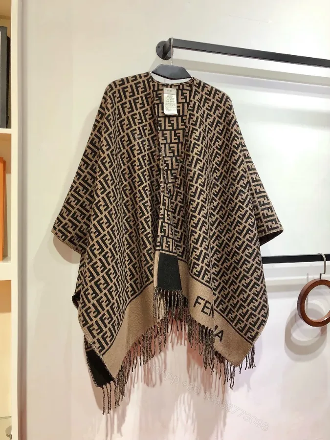 View 1 of Two-Tone Knit Poncho: Luxe Pattern & Soft Fringe