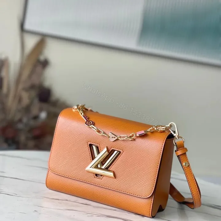 View 1 of Louis Vuitton LV Twist Mini Orange Handbags 23x17x9cm