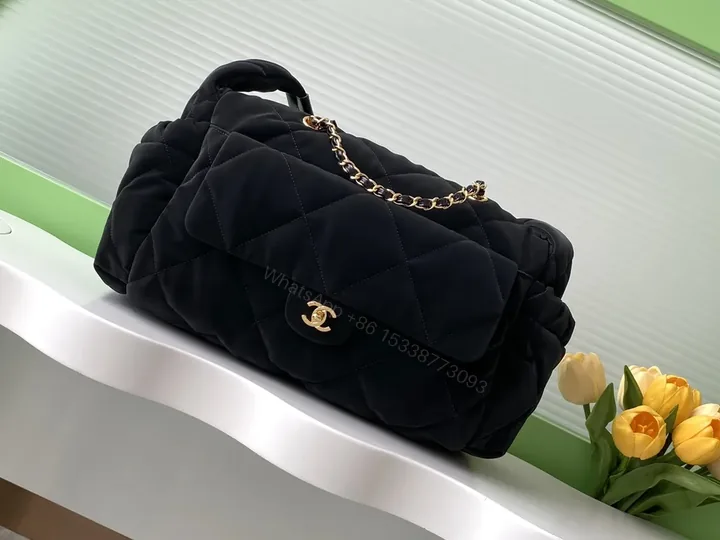 View 1 of Chic Quilted Black Bag with Gold Chain Detail - Compact Luxury