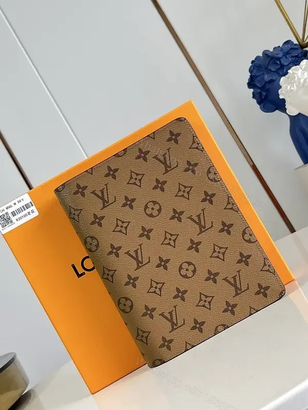 View 1 of Brown Monogram Canvas Bifold Wallet with LV Pattern, Vertical Zipless Style