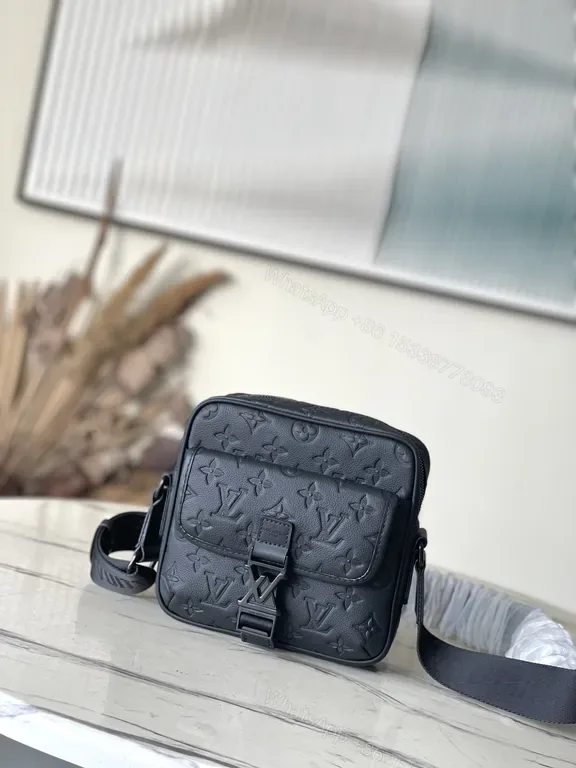 View 1 of Black Monogram Leather Messenger: Compact, Weather-Ready Luxury