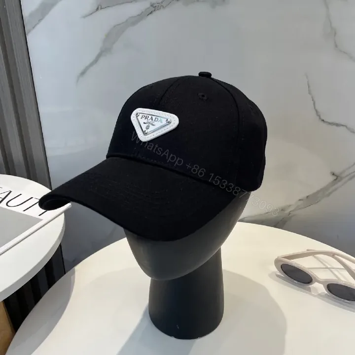 View 1 of Black Cotton Cap with Subtle Triangle Patch Capes?