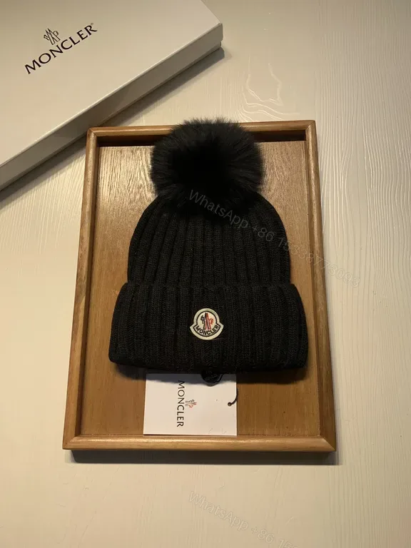 View 1 of Moncler Wool-Blend Beanie with Faux-Fur Pom, Black, Luxury Style