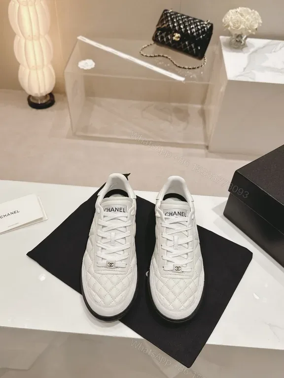 View 1 of White Quilted Platform Sneakers with Chanel Detailing