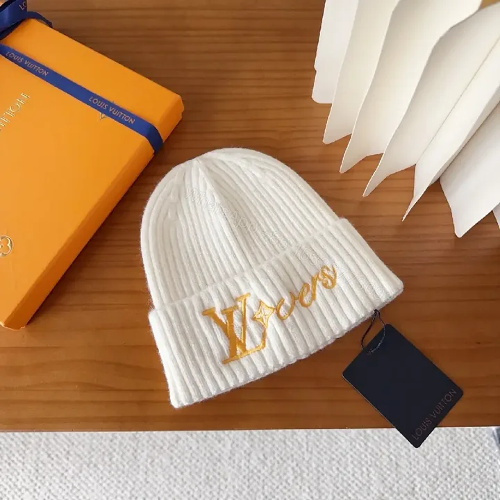 View 1 of Cozy Knit Beanie with Subtle Gold Monogram Embroidery