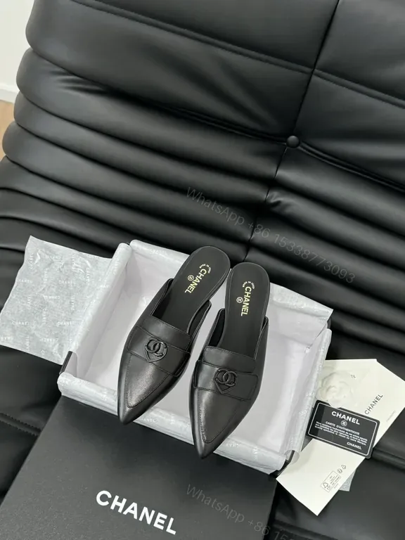 View 1 of Chic Black Leather Mules with CC Detail - Luxury Comfort