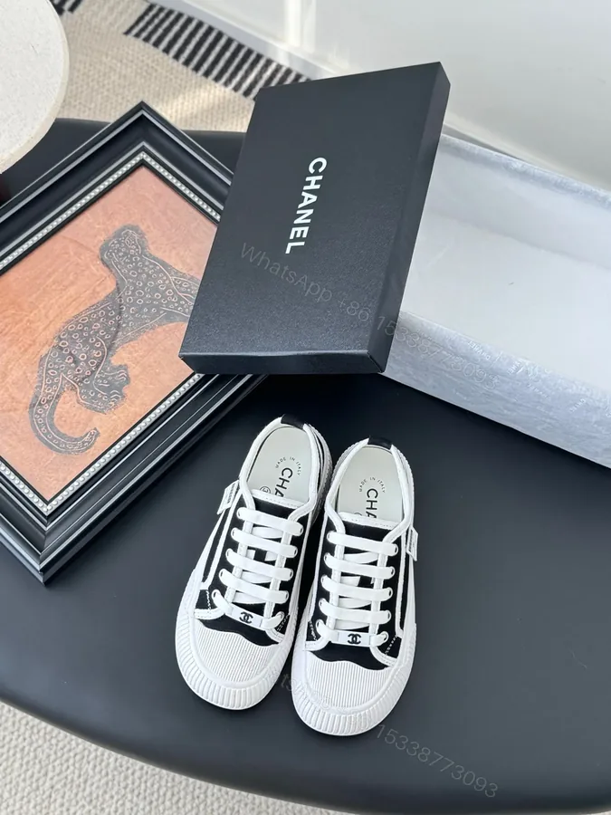 View 1 of Chanel Women Black Canvas White Trim Sneakers