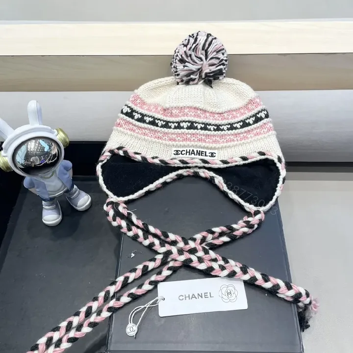 View 1 of Chic Knit Pom Beanie with Braided Tie-Through Straps