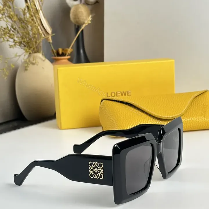 View 1 of Bold Geometry Sunglasses: Black Acetate, Loewe-Logo Edge