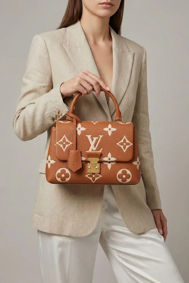 View 1 of Louis Vuitton Madeleine BB Top Handle Orange First Copy | AAA+ Replica Designer Bag