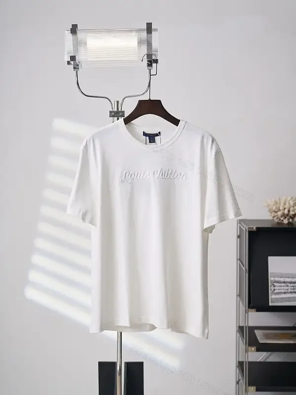 View 1 of White cotton T-shirt with luxury script embroidery for everyday elegance