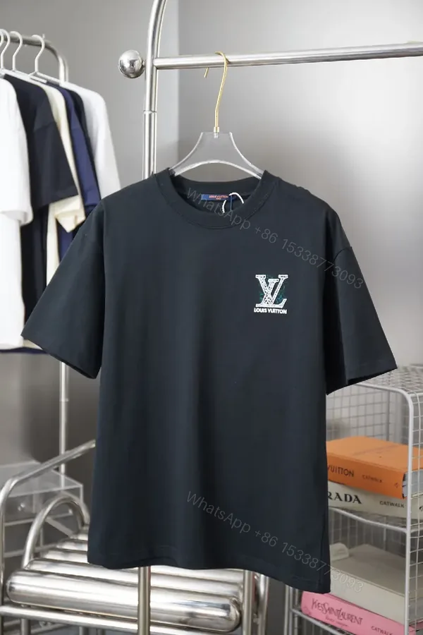 View 1 of Black Cotton Crew Tee with Subtle Crest Embroidery