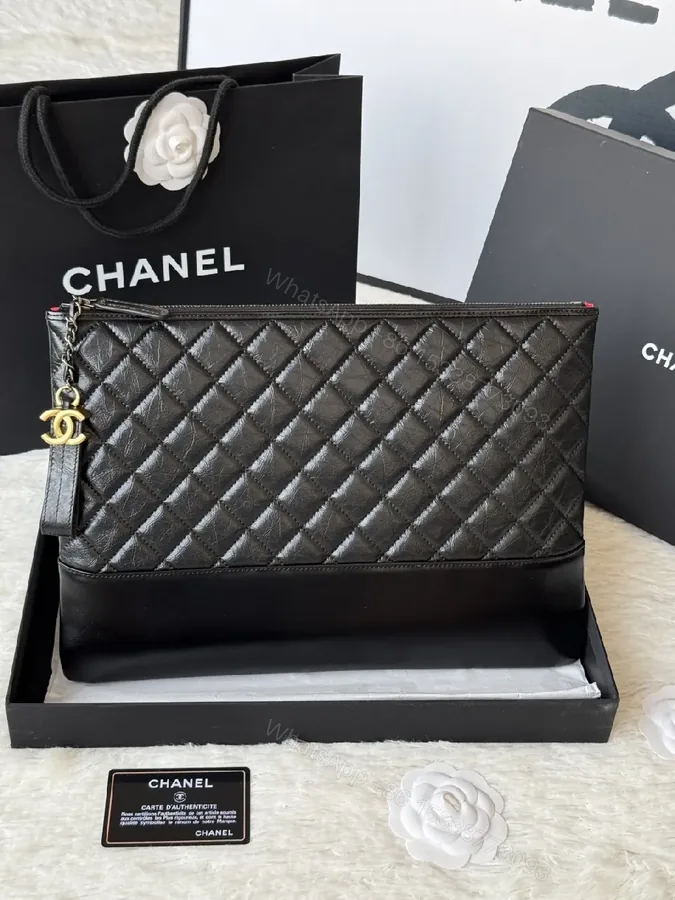 View 1 of Quilted Leather Wristlet: Modern Luxury, Compact Chic