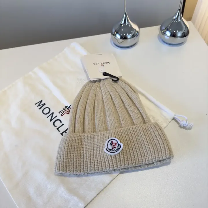 View 1 of Beige Ribbed Knit Beanie – Luxury, Signature Patch, Everyday Style