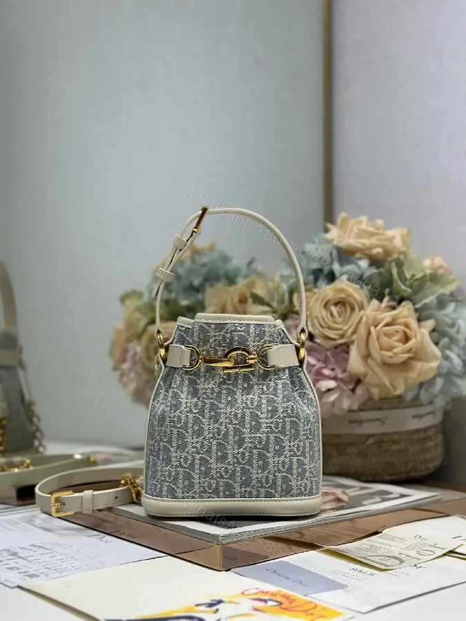 View 1 of Compact Monogram Buckets Bag with Luxe Hardware