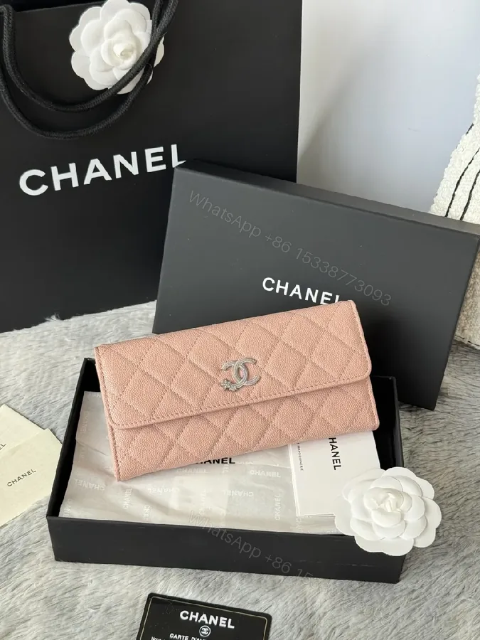 View 1 of Soft Pink Quilted Wallet with Silver Emblem - Compact Luxury Wallet