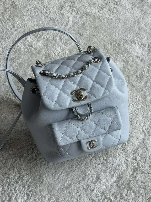 View 1 of Pastel Quilted Backpack with Chain Details â€” Modern Luxury Backpack