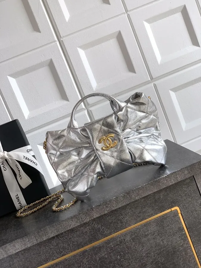 View 1 of Shimmer Quilted Metallic Handbag with Gold Hardware
