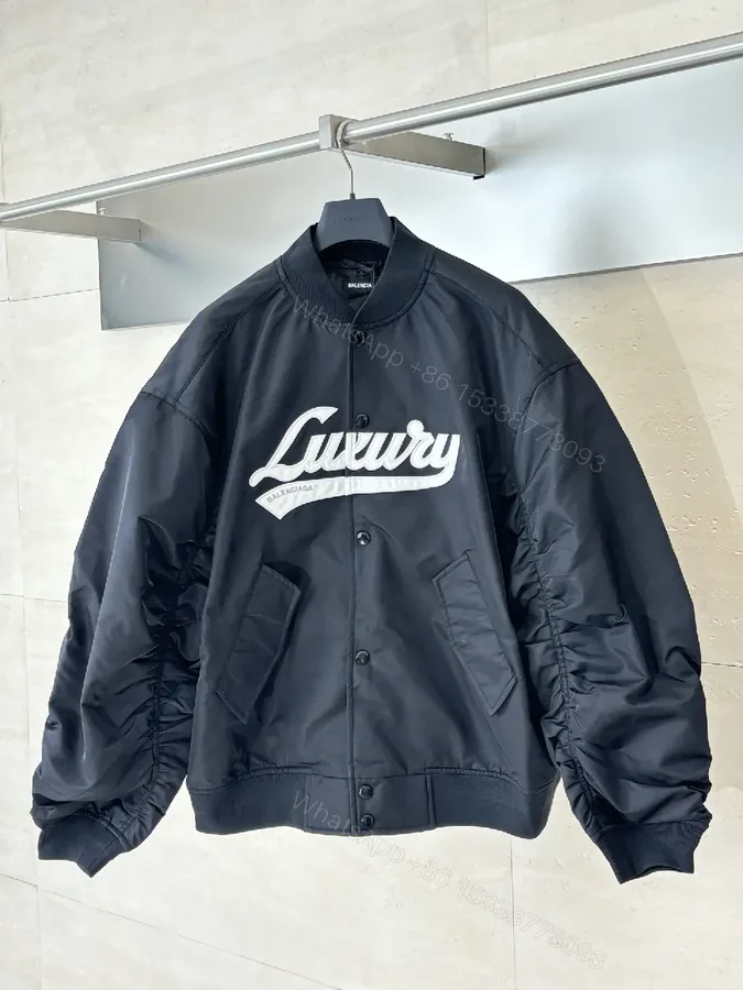View 1 of Bold Black Logo Varsity Jacket | Luxe Streetwear Outerwear