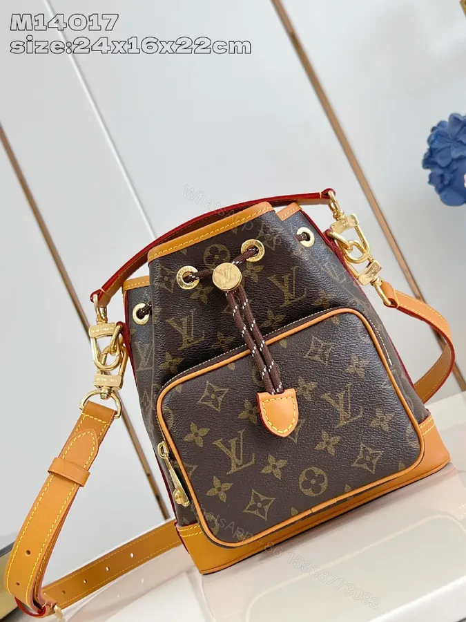 View 1 of Monogram Canvas Crossbody Bucket Bag with Leather Trim