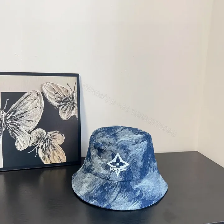 View 1 of Textured Denim Bucket Hat: Luxe, Designer-Inspired Emblem