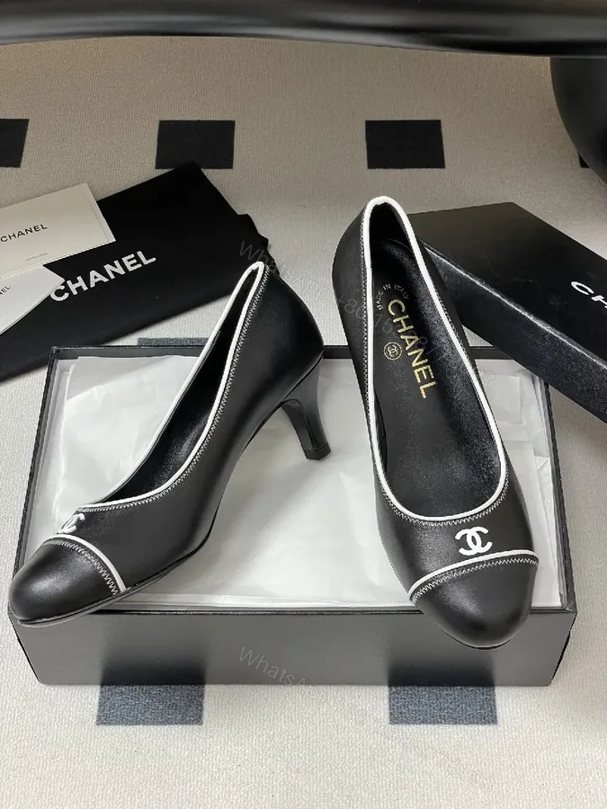 View 1 of Black Leather Kitten-Heel Pumps with Signature Detailing
