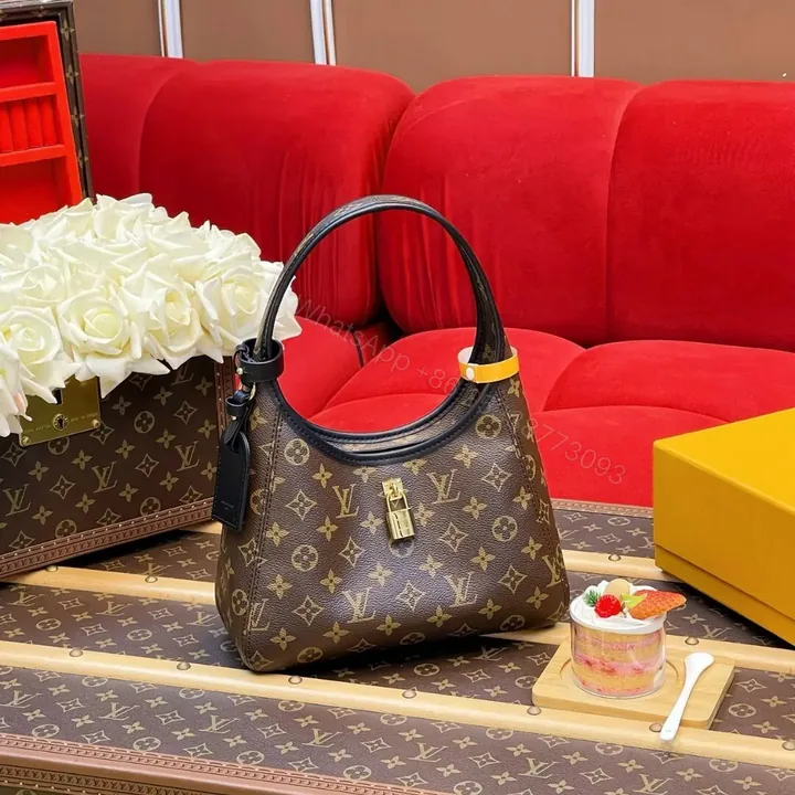 View 1 of Louis Vuitton The Drop PM Handbag in Monogram Coated Canvas