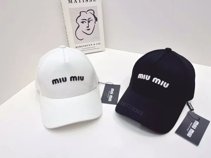 View 1 of Monochrome MIU MIU Cap: Subtle Logo, Everyday Luxury